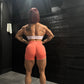 Model showing back on seamless training shorts for women