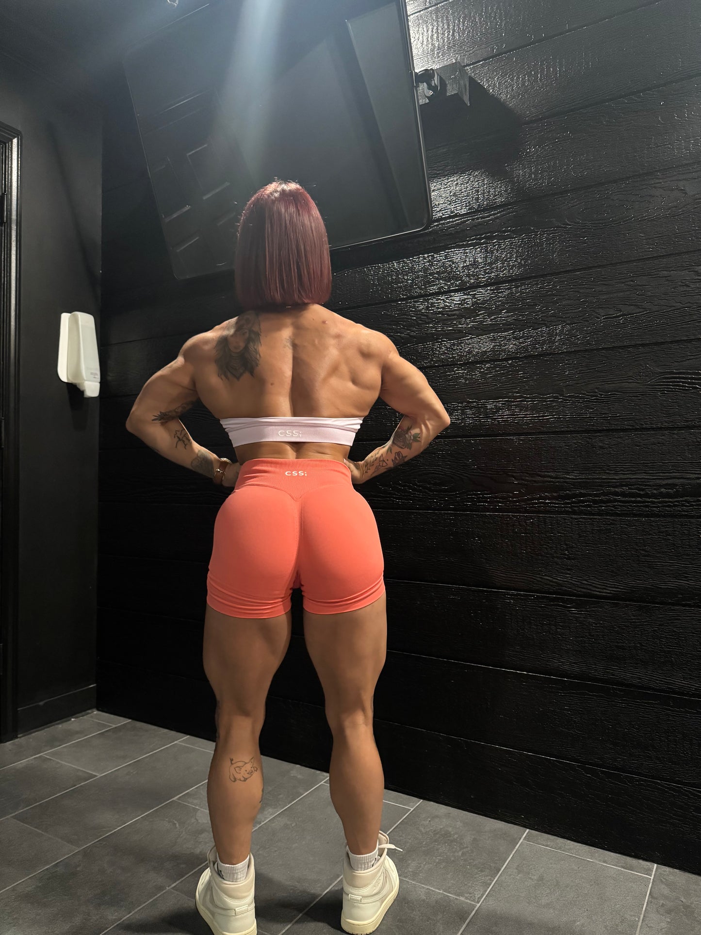 Model showing back on seamless training shorts for women